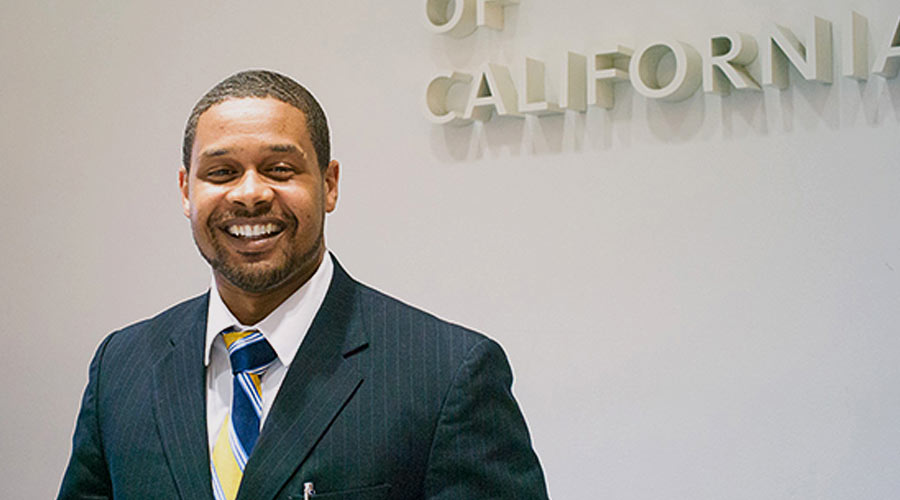 Photo of a smiling man at the University of California